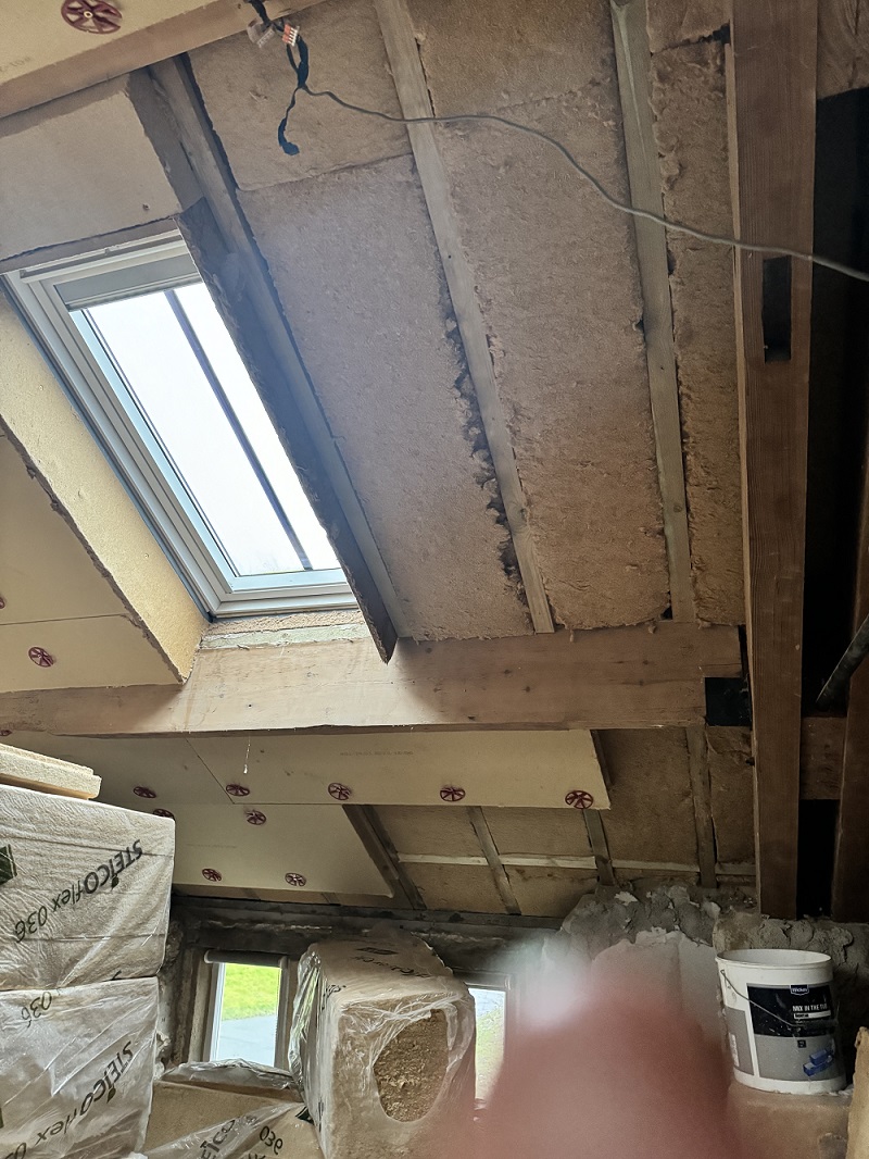 Wood fibre in roof of bedroom - phased retrofit of an 1800s sandstone detached house near Preston